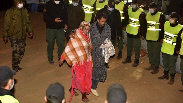 Rayan's parents leaving the scene after their son's body is taken away by ambulance