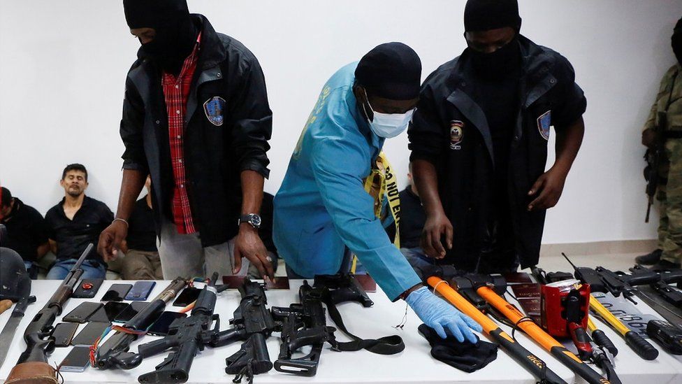 Haiti police presented weapons and some of the detained suspects to the media on Thursday