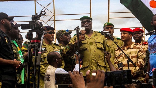 Members of the military attend a rally in Niamey on 6 August