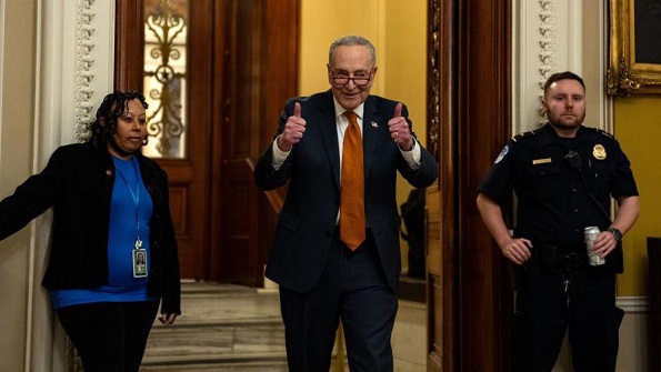 Democratic Senate Majority Leader Chuck Schumer gives a thumbs up walking out of the Senate Chamber