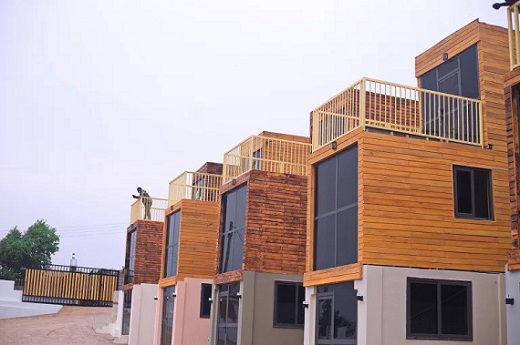 Finished eco-homes made from shipping containers. These are much less expensive than traditional houses and use less energy [Courtesy of Eric Kwaku Gyimah]