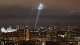 Ukrainian service personnel use searchlights as they search for drones in the sky over Kyiv on Tuesday night